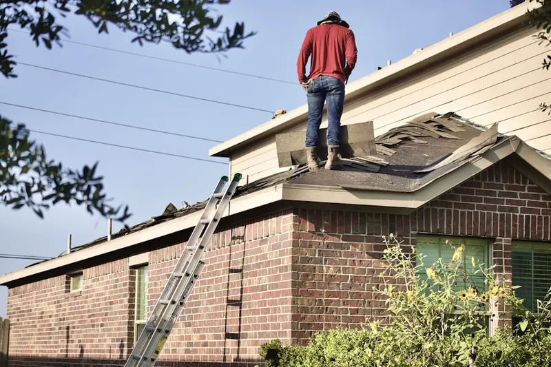 Professional roofer working on a residential roof in Sunrise Lakes